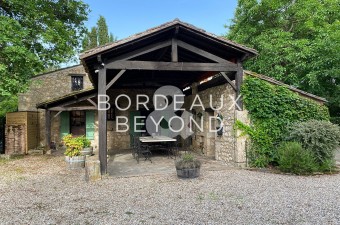 This 17th century farmhouse is a spacious family home with 5 bedrooms and exceptional reception space. Located on the banks of the Dordogne river with heated swimming pool.