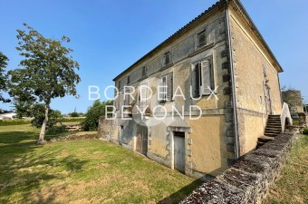 Beautiful maison de maitre property with far reaching views. Enormous potential for this partly renovated property that is comprised of a main house of 500m2, an old mill and over 1 hectare of land.