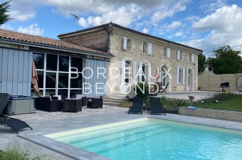 Attractive stone property of 328m² with swimming pool renovated in a contemporary style whilst keeping its original charm.